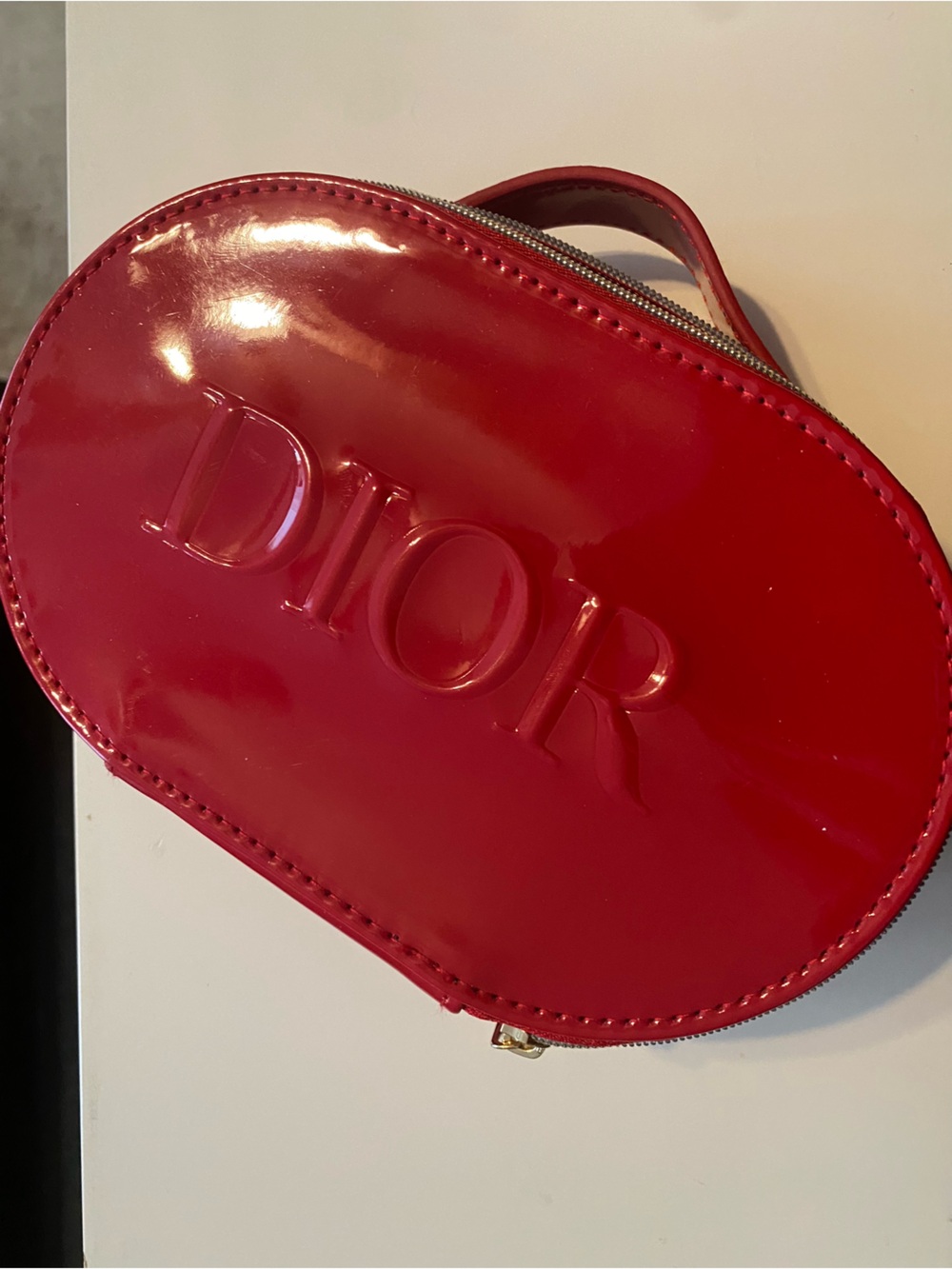 Dior Glossy Red Embossed Oval Cosmetic Case